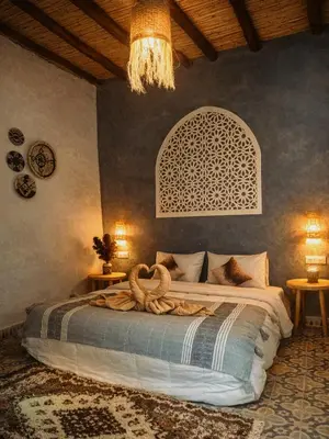 a bedroom with a large bed in a room at Chez aubazine in Merzouga
