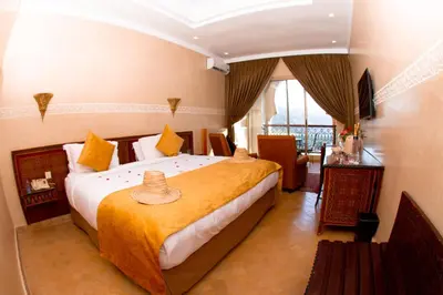 a bedroom with a large bed in a room at Borj Des Cascades & Spa in Ouzoud