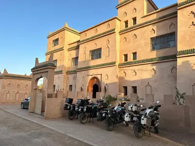 a group of motorcycles parked in front of a building at Desert Villa Boutique Hotel Merzouga in Merzouga