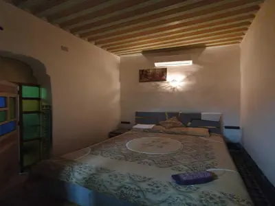 a bedroom with a large bed in a room at Hostel Rcif in Fès