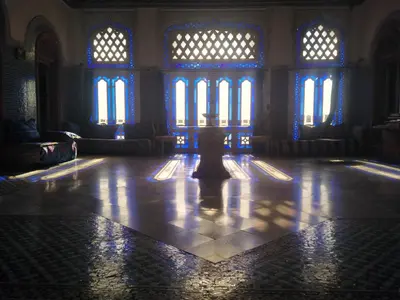 a large room with blue light shining through the windows at suite in a XVIIIe palace in Fès