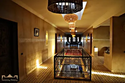 a hallway of a hotel with chandeliers at Sunrise Palace Merzouga in Merzouga