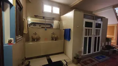 a small bathroom with a sink and a window at Guesthouse Panorama Todra in Tinerhir