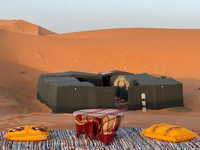a tent in the middle of a desert at Nomada Desert Camp in Merzouga