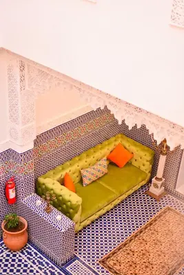 a toy house with a couch in a room at Riad Dilar Fes & Spa in Fès