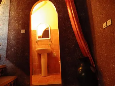 a bathroom with a sink and a mirror at Jad Auberge in Ourika