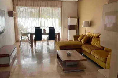 a living room with a couch and a table at Luxury Prestigia Close to Champs de Course Parc in Fès