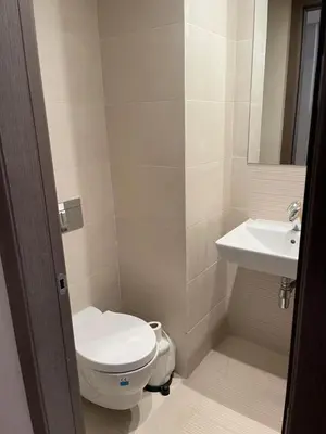 a bathroom with a toilet and a sink at Luxury Prestigia Close to Champs de Course Parc in Fès