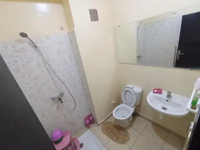 a small bathroom with a toilet and a sink at Maison Jad in Ifrane