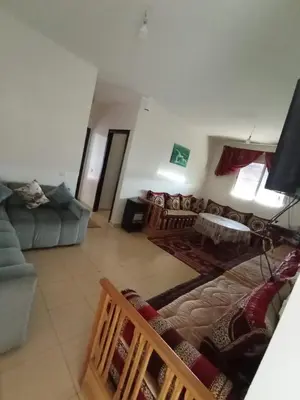 a view of a living room with a couch and a living room at Maison Jad in Ifrane