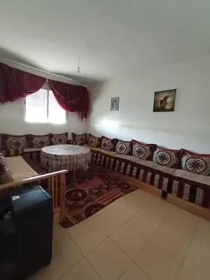 a living room with a couch and a table at Maison Jad in Ifrane