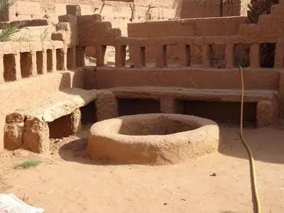 a building with a bowl in the dirt at Auberge Tigida in Mhamid