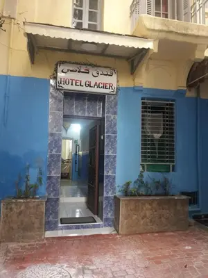 a blue building with a hotel clacer sign on it at Hôtel Glacier in Fès