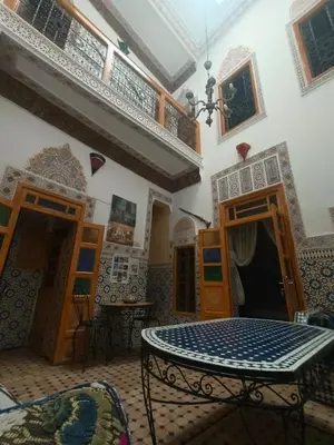 a room with a table in a building at RIaD DRISSIA Panoramic in Fès