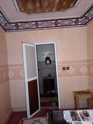 a room with a mirror and a ceiling at Gte Tawada - Haut-atlas - Chambre pour 2 Personnes in Ikhf nʼIghir