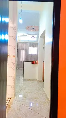 a hallway of a room with a marble floor at Dar abd essalam in Moulay Yacoub