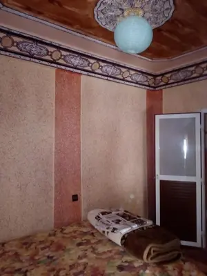 a room with a bed and a ceiling at Gte Tawada - Valle Heureuse - Chambre pour 4 Personnes in Agouti