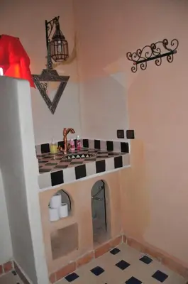 a model of a kitchen with a stove top oven at Maison Acacias in Erfoud