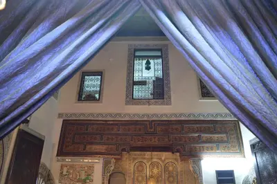 a view of a room with a blue curtain at Chez L'habitant Boueden in Fès