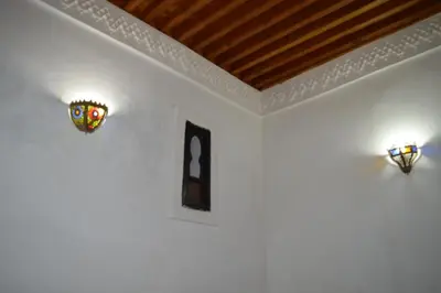 a room with two stained glass windows on the wall at Chez L'habitant Boueden in Fès