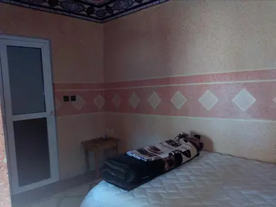 a bedroom with a bed in a room at Gte Tawada - Valle Heureuse - Chambre pour 3 Personnes in Agouti
