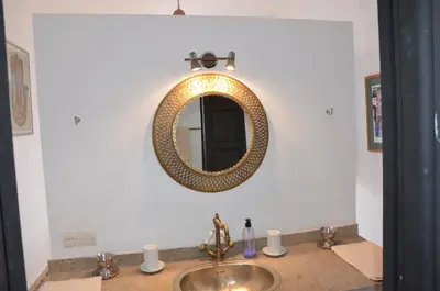 a bathroom with a sink and a mirror on the wall at ourika oufla in Ourika