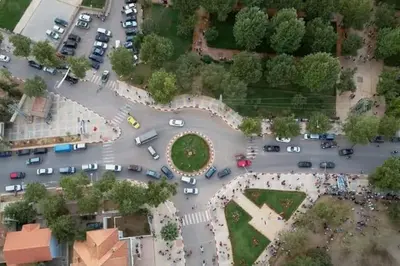 an aerial view of a parking lot with cars at appartement chalet in Imouzzer Kandar