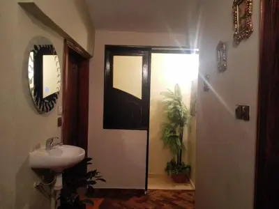 a bathroom with a sink and a mirror at appartement chalet in Imouzzer Kandar