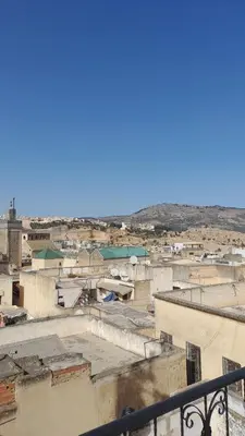 arial view of a city with roofs and buildings at Riad amal in Fès
