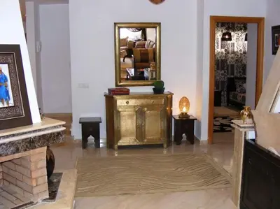a room with a mirror on the wall and a table at Beautiful Apartment Hamria in Meknès
