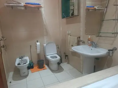 a bathroom with a toilet and a sink at Beautiful Apartment Hamria in Meknès