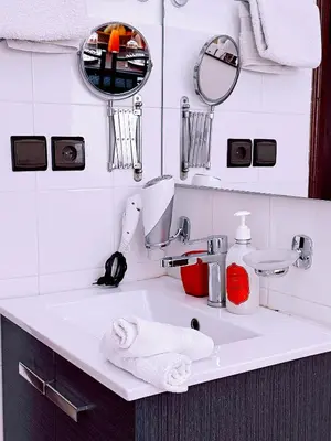 a bathroom with a sink with a towel on it at Residence Chay - Luxury Appart in Ouarzazate