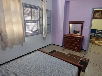 a room with a mirror and a dresser in it at Apartment Hamria Meknes BT in Meknès