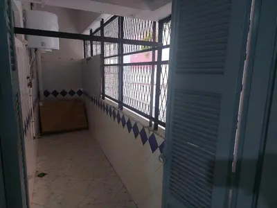 an empty hallway of a bathroom with a window at Apartment Hamria Meknes BT in Meknès