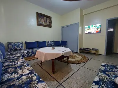 a living room with a couch and a table at Apartment Hamria Meknes BT in Meknès