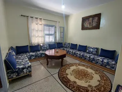 a living room with a couch and a table at Apartment Hamria Meknes BT in Meknès