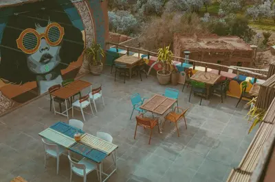 an overhead view of a patio with tables and chairs at taman'art space in Aït Ben Haddou
