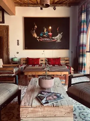 a living room with couches and a coffee table at taman'art space in Aït Ben Haddou