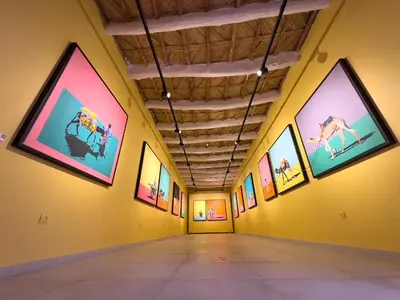 an art gallery with paintings on the walls at taman'art space in Aït Ben Haddou