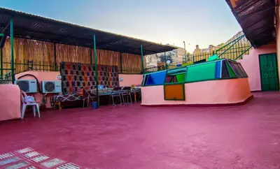 a large room with a water slide on a purple floor at Riad Basma Fes - Brand New Bathrooms & AC in Fès