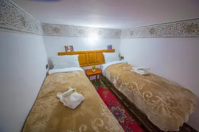 a room with two beds in a room at Riad Basma Fes - Brand New Bathrooms & AC in Fès