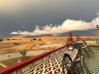 a view of the desert from the balcony of a resort at Kasbah Azalay Merzouga takojt in Merzouga