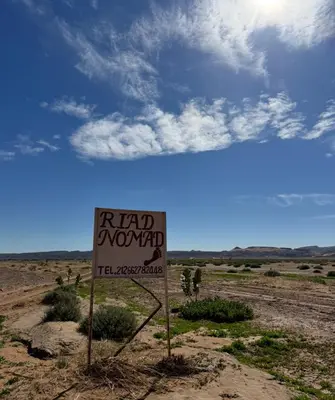 a road moved sign in the middle of the desert at Riad Nomad in Foum Mharech