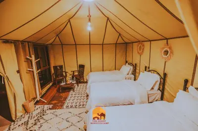 a bedroom with two beds in a tent at Trek desert Morocco Sarl in Taouz