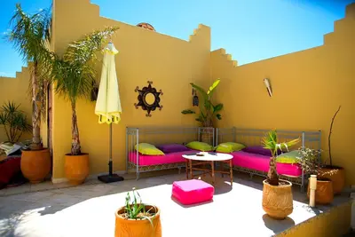 a patio with a couch and a table at Riad Safir in Meknès