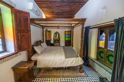 a bedroom with a bed in a room at Dar Chez Khadija in Fès