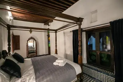 a bedroom with a bed with two towels on it at Dar Chez Khadija in Fès