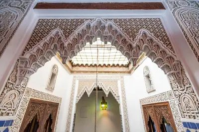 an ornate room with a chandelier in a building at Dar Chez Khadija in Fès