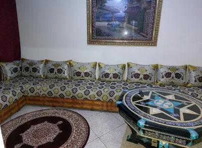 a living room with a couch and a table at Appartement Hamria RiF in Meknès