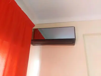 a flat screen tv on the ceiling of a room at Appartement Hamria RiF in Meknès